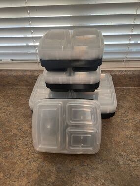 Stack of Clear Plastic Meal Prep Containers with Black Bases 49 total containers